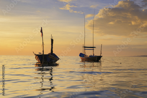 seascape sunset with fishing boat at sea,Rayong Province,Thailand