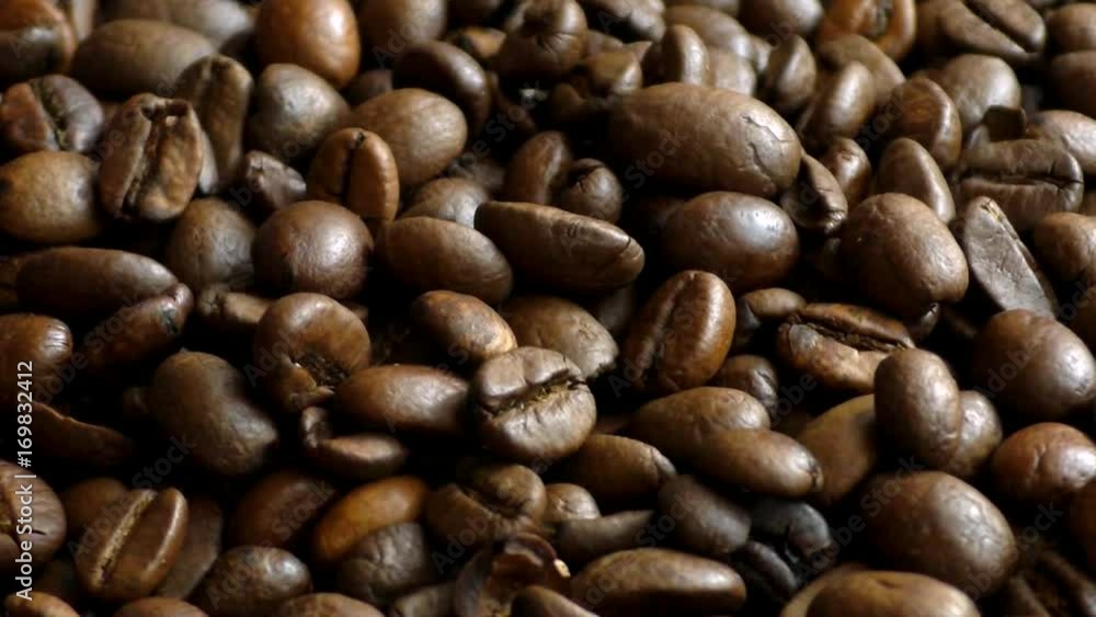 Close-Up of Fragrant fried coffee beans. Falling Close-Up of Fragrant fried coffee beans. Falling