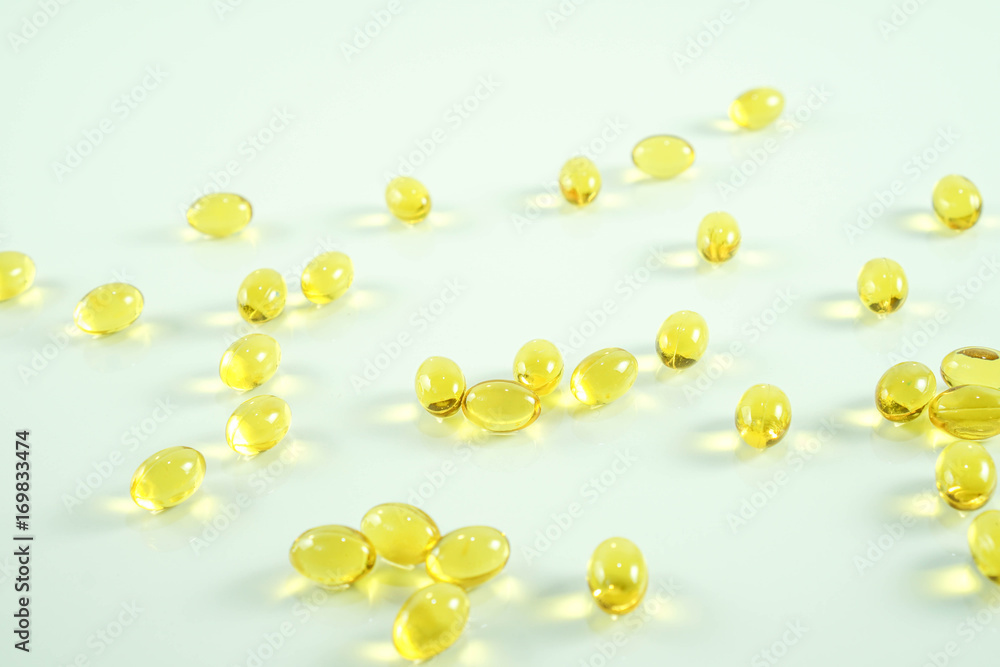 custom made wallpaper toronto digitalFish oil capsule, yellow soft gels capsules, Yellow oil pills on white background