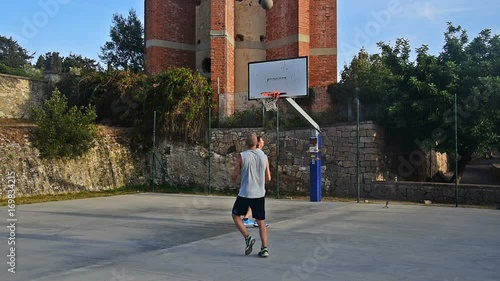 Uncontested three point shot in a one on one basketball game photo