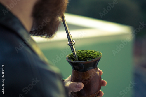 Man drinking the traditional drink of the gauchos - The chimarrao - Rio Grande do Sul - Southern Brazil.
