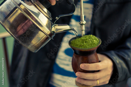 Man serving chimarrao - the typical drink of the gaucho people - Rio Grande do Sul - Southern Brazil.