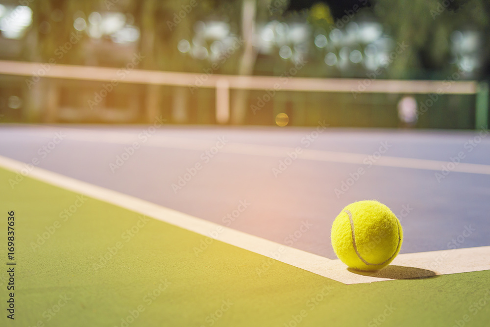 Tennis ball at the hard court corner line