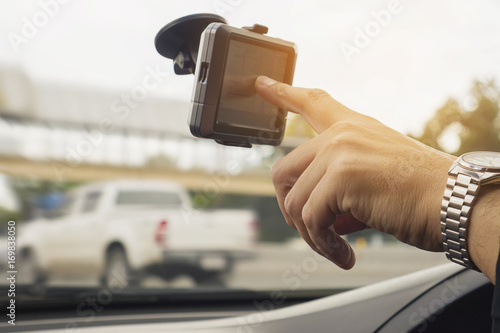 Man driving car using navigator