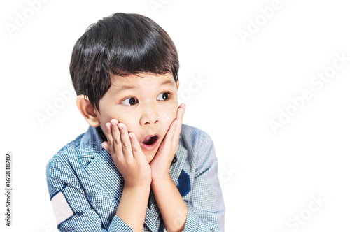 Foto Asian boy is making expression isolated over white