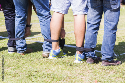 Five legged race outdoor party game, harmonious unity concept