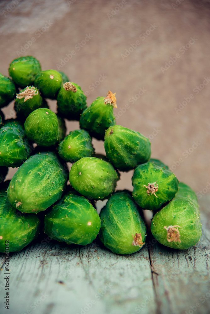 Pile of fresh organic cucumbers on a market Pile of fresh organic cucumbers on a market