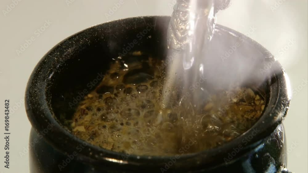 Pouring hot water into Mate Pouring hot water into Mate