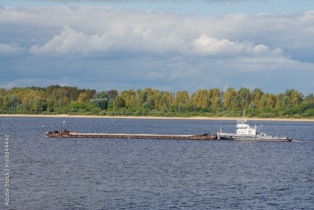 Obraz premium a cargo barge on the Volga