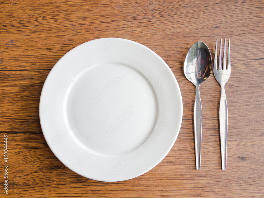 fork and spoon on white dish fork and spoon on white dish