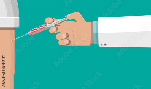 Fotografija Doctor hand with syringe, vaccination of patient.