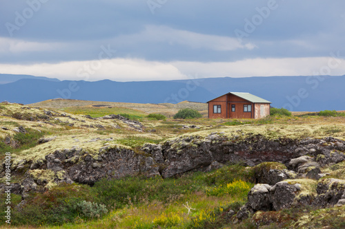 Small wooden cottage in Iceland landscape