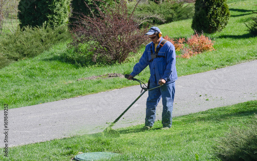 Wallpaper Mural The man tidies up the lawn Torontodigital.ca