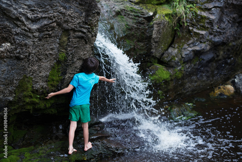 The boy near the waterfall
