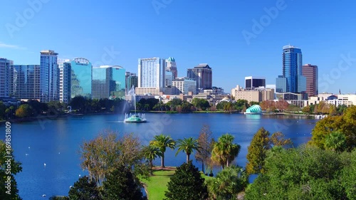 Orlando FL aerial Orlando Lake Eola in the morning with urban skyscrapers and clear blue sky trees photo