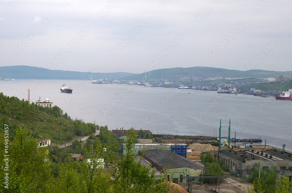 View of the Kola Bay, site No. 2 of a shipyard, areas of the city named Abram-Mys and Growth, Murmansk, Russian Federation