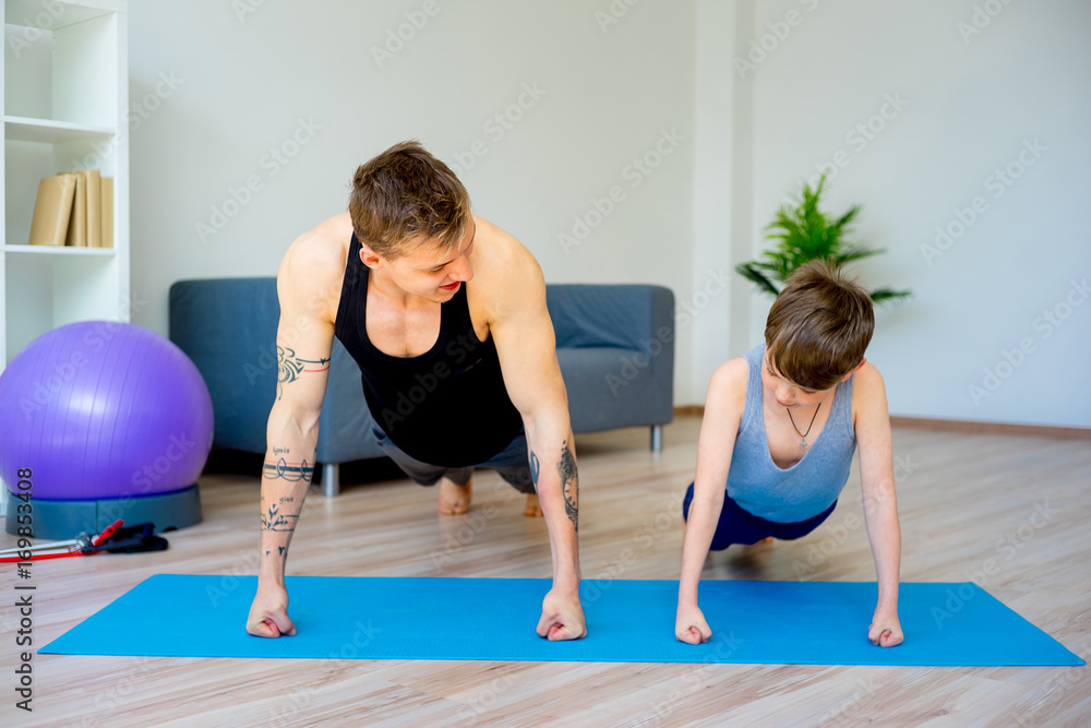 Father and son doing push ups Father and son doing push ups