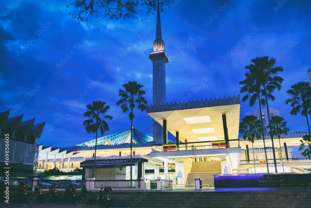 The minaret that towers above the National Mosque Masjid Negara at night, Kuala Lumpur, Malaysia.