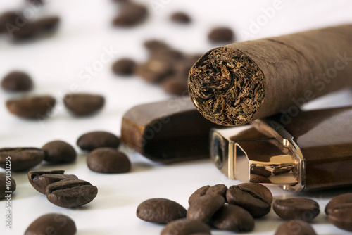 Macro of cigar with coffee beans and lighter