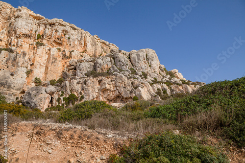Limestone cliff of Southern shore of Malta island. Summer sunny day. Panoramic view.