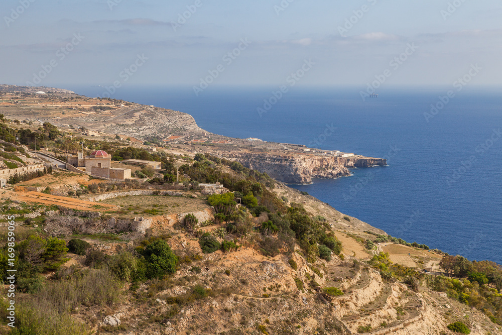 Limestone rocks and azure sea of Malta island. Panoramic view.