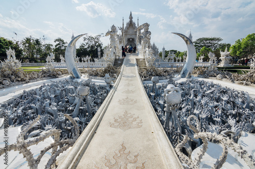 Wat Rong Khun (White Temple) - art exhibit in the style of a Buddhist temple in Chiang Rai Province, Thailand photo