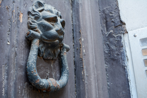 ancient clapper on an ancient door