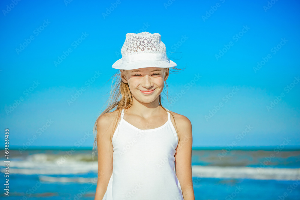 Happy little Girl on the beach.