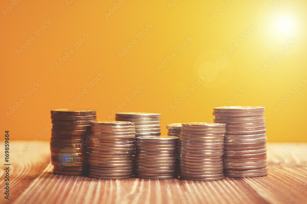 Coins on a yellow background, sun
Coins on a yellow background, sun