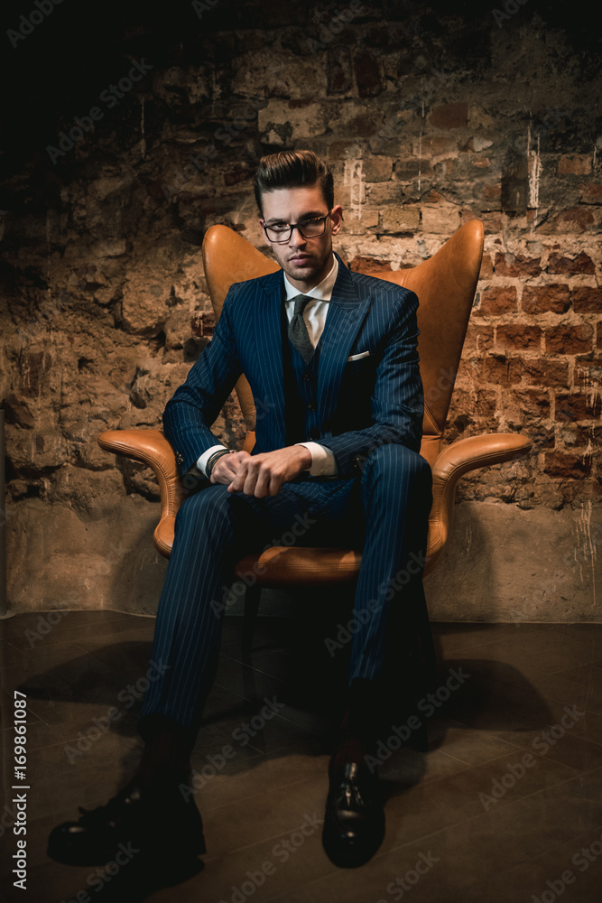 Sharp dressed dandy in a chair Sharp dressed dandy in a chair