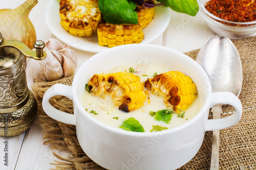 Cream soup with slices of corn grill