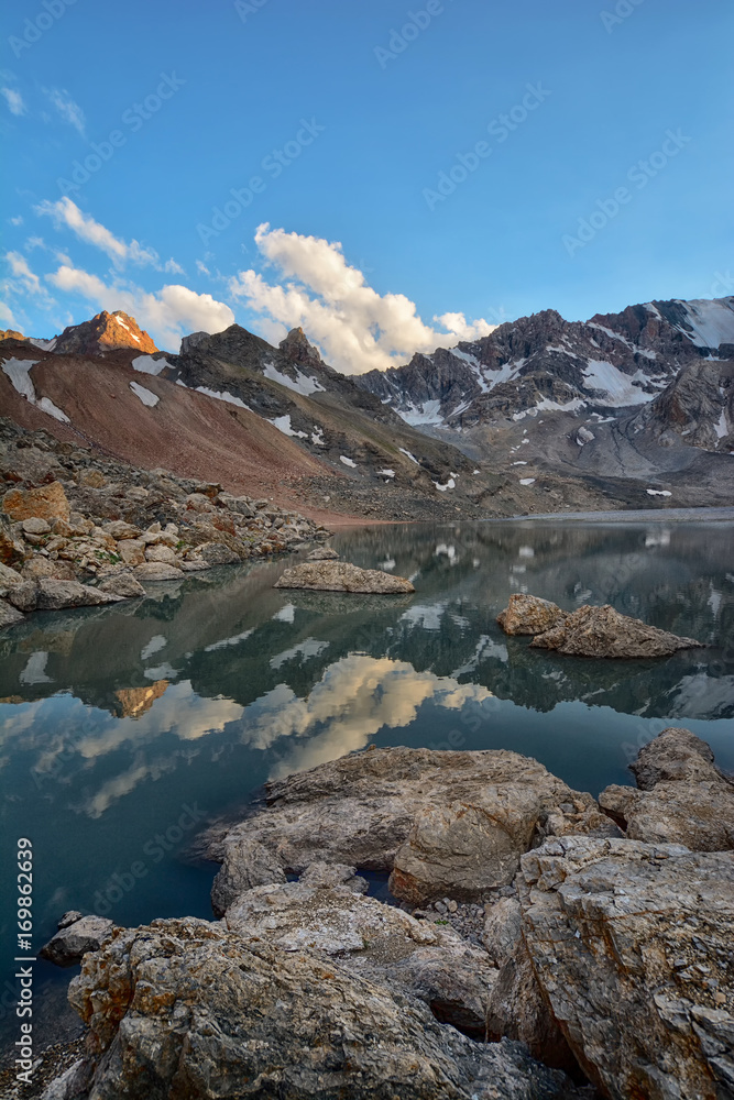 Landscape of beautiful high rocky Fan mountains and lake in Tajikistan