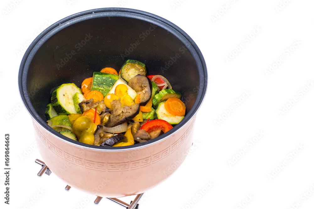 Stewed seasonal vegetables in saucepan. Studio Photo Stewed seasonal vegetables in saucepan. Studio Photo
