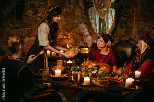 Wallpaper Mural Medieval people eat and drink in castle tavern. Torontodigital.ca