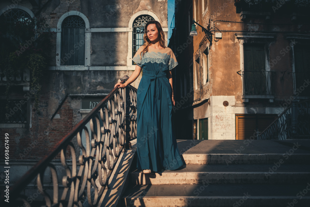 Beautiful woman on a bridge in Venice, Italy