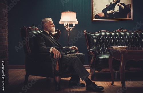 Well-dressed senior man in luxury interior © Nejron Photo