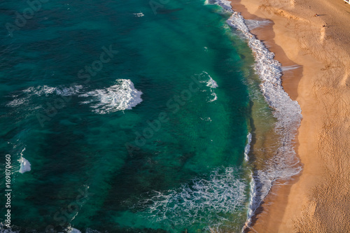 Aerial beach view with sea water and yellow sand © willyam