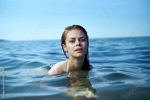Beautiful woman is swimming in the sea, portrait © SHOTPRIME STUDIO