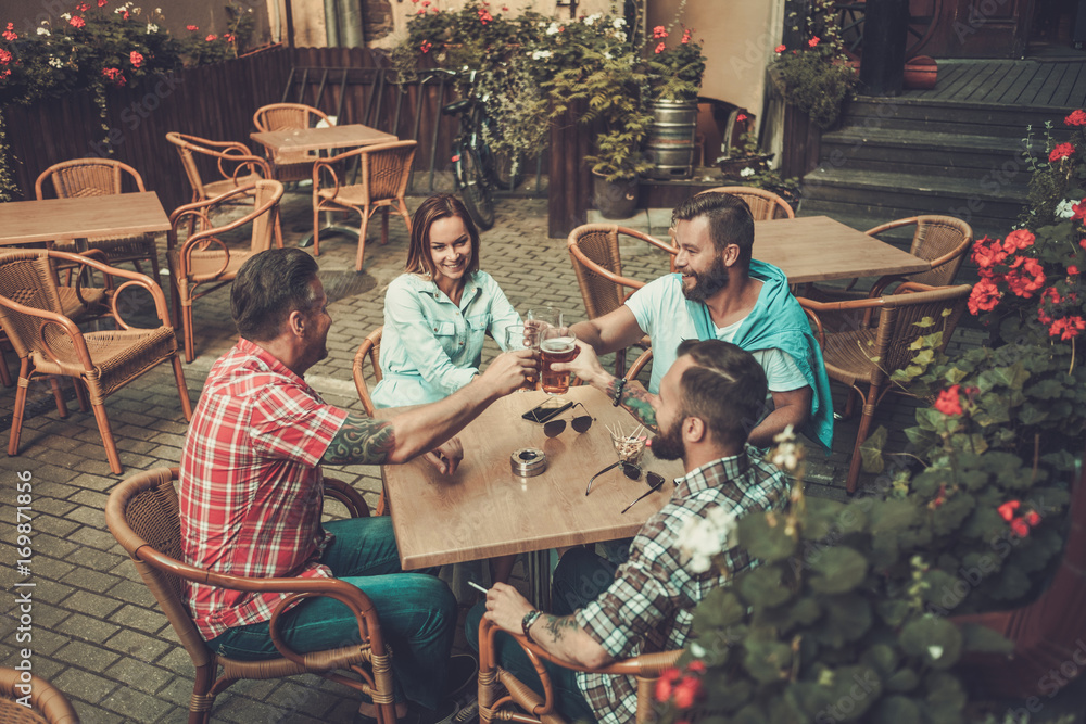 Good old friends drinking beer in a pub Good old friends drinking beer in a pub