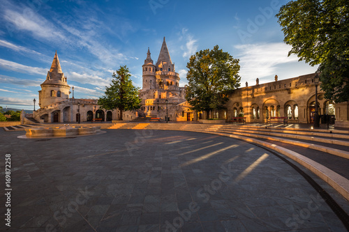 Budapest, Hungary - Morning view of the Fisherman Bastion on top of Buda Hill with beautiful lights and sky at sunrise © zgphotography