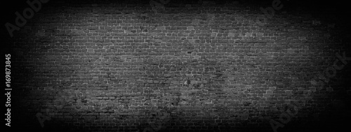 Obraz na płótnie Black brick wall panoramic background.