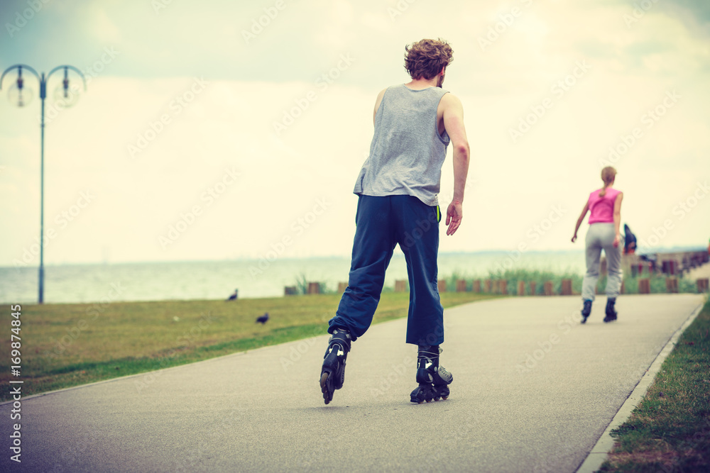Fototapeta premium roller skater couple skating outdoor