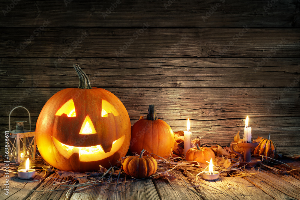 Fototapeta premium Halloween Pumpkins And Candles On Wooden