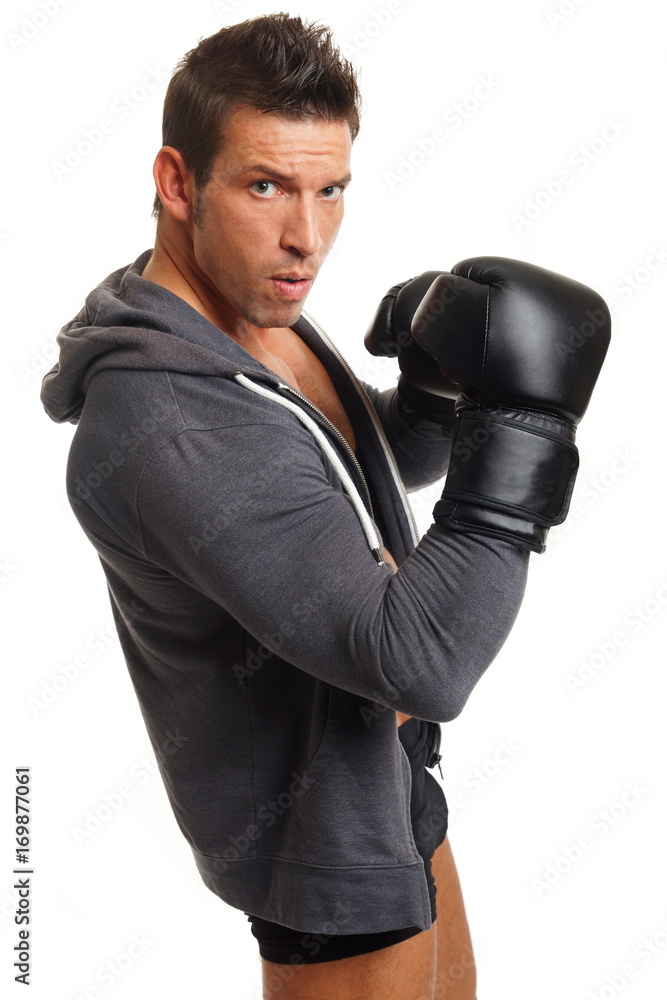 Muscular man with boxer gloves on white background Muscular man with boxer gloves on white background