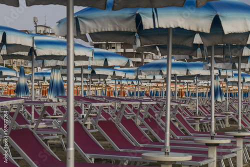 Beach with parasols and sun loungers in Italy