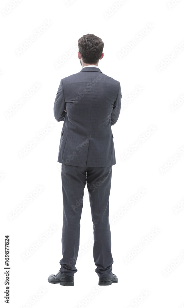 rear view, full-length of a businessman standing and looking forward. rear view, full-length of a businessman standing and looking forward.