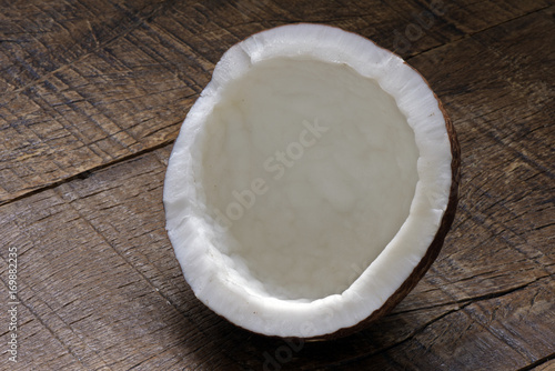 Broken coconut on table