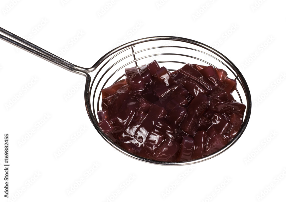 brown topping for ice cream in spoon isolated on white background brown topping for ice cream in spoon isolated on white background