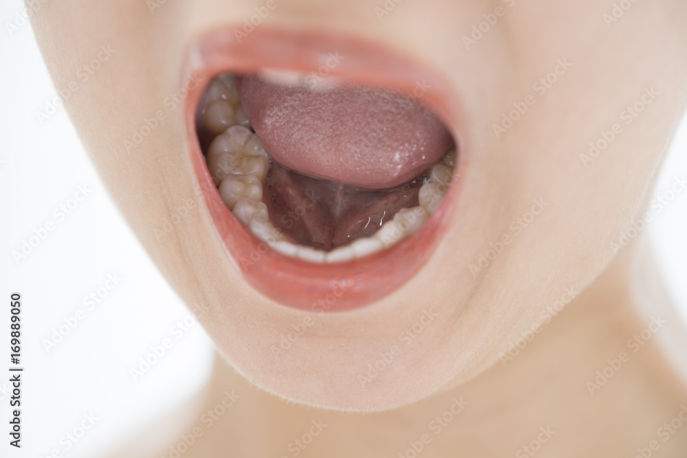 Fototapeta premium A woman applying lipstick