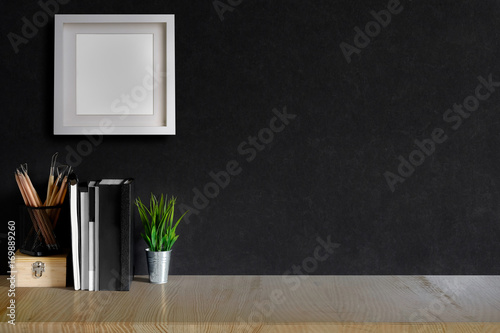 Fototapeta Naklejka Na Ścianę i Meble -  Marble top table with books, brush and houseplant at home or studio. Copy space for products display montage.